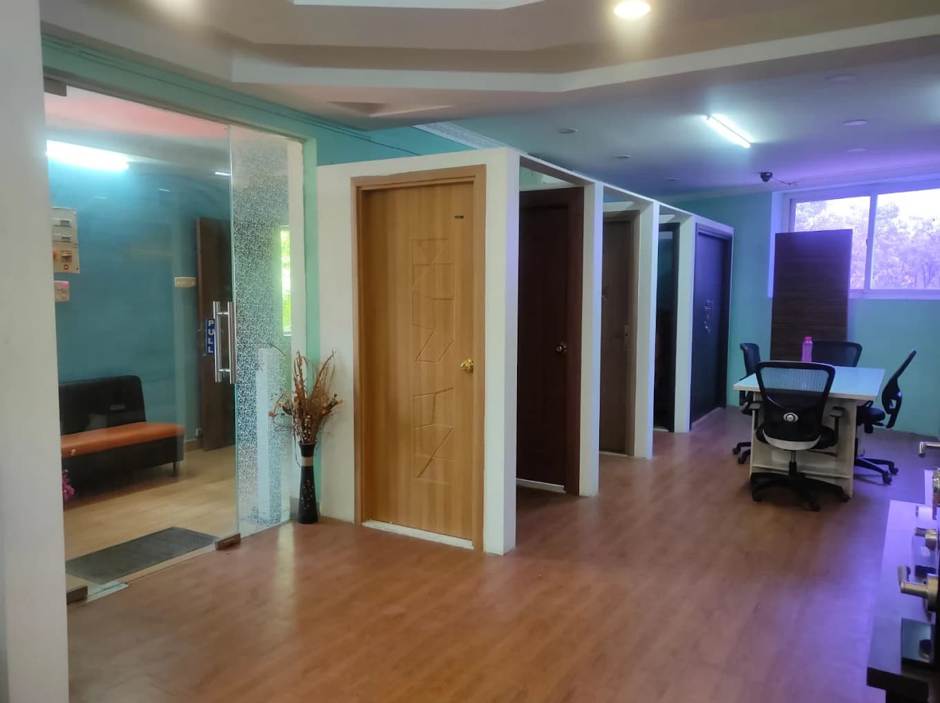 KASSA showroom with ABS doors on display in frames along the wall